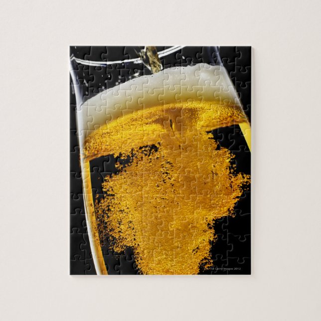 Beer been poured into glass jigsaw puzzle (Vertical)