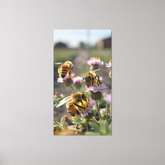 Bees collect pollen from wildflowers on the farm canvas print