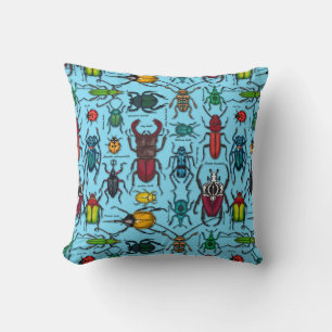 Beetles on blue cushion