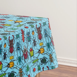 Beetles on blue tablecloth