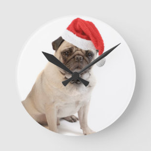Beige pug with red santa hat on round clock