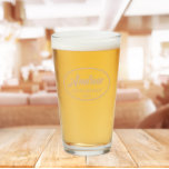 Beige Stylised Wedding Groomsman Name Glass<br><div class="desc">Beer glass for the wedding groomsman that features his name printed in a trendy beige colour, stylised script inside a beige colour oval border along with wedding date. A great party supply idea for a bachelor party! Personalise your beer glass by editing and replacing name and date with your own....</div>