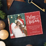 Believe in Christmas magic 2 family photos red Holiday Card<br><div class="desc">Modern holiday greeting card featuring one of your favourite Christmas family portraits on the left complemented by the words "Believe in the magic of Christmas" on the right over a festive red background, customisable with your own greeting message. You can upload one more picture on the reverse of the card....</div>