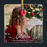 Believe in Christmas Sparkles Photo Overlay Pretty Ceramic Ornament<br><div class="desc">This beautiful Christmas ornament features a simple yet elegant design with your photo surrounded by festive sparkles or stars. The caption is written in a handwritten script font and reads: believe. There is space for your name and the year. Perfect as a gift for extended family, or as an annual...</div>