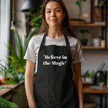 Believe in Magic Black and White  Apron<br><div class="desc">Add a touch of elegance and charm to your holiday cooking with the "Believe in Magic" black and white apron. This minimalist design features a stylish black and white colour palette with an inspiring "Believe in Magic" message, making it the perfect addition to your Christmas kitchen attire. Whether you're preparing...</div>