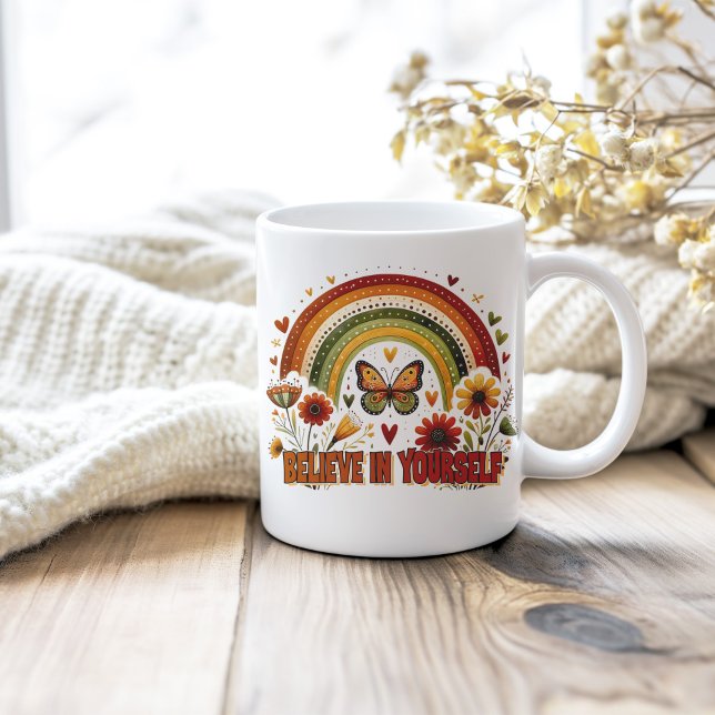 Believe in Yourself Boho Rainbow Flowers Butterfly Coffee Mug (Believe in Yourself Boho Rainbow Flowers Butterfy Coffee Mug on a neutral cozy wooden table.)