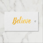 Believe typography minimalist Foil Gift Tag<br><div class="desc">Believe in typography and minimalist design in gold foil. The back text is Christmas,  and the year is in gold colour. A place for to and from names. These can be personalised. Simple and sophisticated.</div>