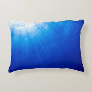 Below beneath blue deep dive decorative cushion