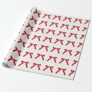berry red ribbon bows on cream christmas holiday wrapping paper