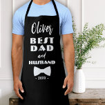 Best Dad and Husband Tie Elegant Black Apron<br><div class="desc">Best Dad and Husband Black Tie Elegant Black Apron. Modern typography and a tie. Add dad's name,  year and any text. A lovely keepsake for a father and husband. Gift for Father's day,  birthday or Christmas.</div>