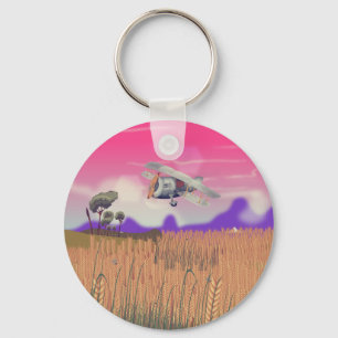 Bi-Plane Flying over crops under setting sun Key Ring