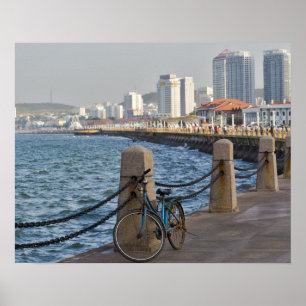 Bicycle at waterfront with Yantai city skyline, Poster