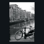 Bicycle by Canal Poster<br><div class="desc">Netherlands, Amsterdam, bicycle parked by canal (B&W) | Tancredi J. Bavosi | AssetID: 200529149-001</div>