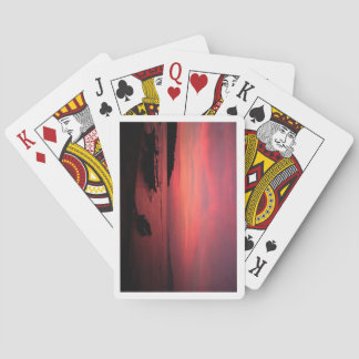 Bicycle playing cards with a sunset on the back