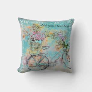 Bicycle with flower baskets on blue burlap cushion