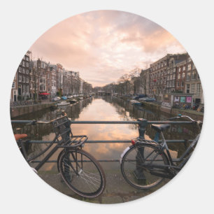 Bicycles at sunset in Amsterdam Classic Round Sticker