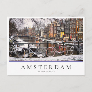 Bicycles in the snow in Amsterdam Postcard