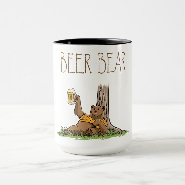 big brown leaning on a tree holding bear glass mug (Center)