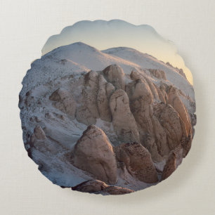 BIG ROCK FORMATIONS COVERED WITH SNOW ROUND CUSHION