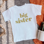 Big Sister | Gold Matching Sibling Family Baby T-Shirt<br><div class="desc">Custom printed apparel personalised with "Big Sister" graphic in trendy modern font. Perfect for a pregnancy announcement photo or a gift for older siblings when new baby arrives! Use the design tools to edit the colours or add your own text and photos to create a one of a kind custom...</div>