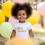 Big Sister | Gold Matching Sibling Family Baby T-Shirt<br><div class="desc">Custom printed apparel personalised with "Big Sister" graphic in trendy modern font. Perfect for a pregnancy announcement photo or a gift for older siblings when new baby arrives! Use the design tools to edit the colours or add your own text and photos to create a one of a kind custom...</div>
