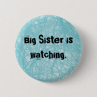 Big Sister is watching. Round blue button