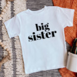 Big Sister | Matching Sibling Family Baby T-Shirt<br><div class="desc">Custom printed apparel personalised with "Big Sister" graphic in trendy modern font. Perfect for a pregnancy announcement photo or a gift for older siblings when new baby arrives! Use the design tools to edit the colours or add your own text and photos to create a one of a kind custom...</div>