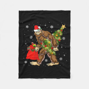 Bigfoot Carrying Christmas Tree Sasquatch Believer Fleece Blanket