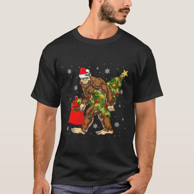 Bigfoot Carrying Christmas Tree Sasquatch Believer T-Shirt (Front)