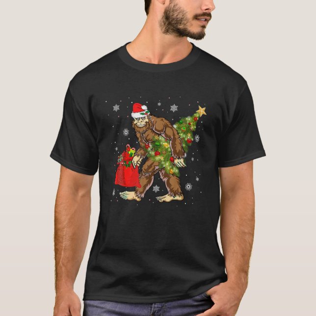 Bigfoot Carrying Christmas Tree Sasquatch Believer T-Shirt (Front)