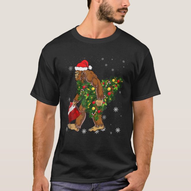 Bigfoot Carrying Christmas Tree Sasquatch Believer T-Shirt (Front)