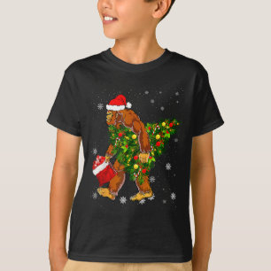 Bigfoot Carrying Christmas Tree Sasquatch Believer T-Shirt