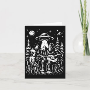 Bigfoot playing guitar with alien and ufo card