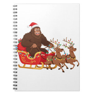 Bigfoot Riding a Christmas Sleigh Through the Snow Notebook