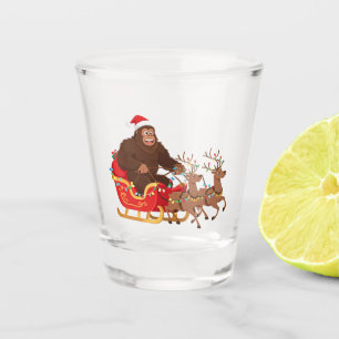 Bigfoot Riding a Christmas Sleigh Through the Snow Shot Glass