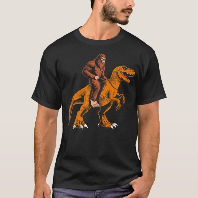 Bigfoot riding dinosaur kids sasquatch riding t re T-Shirt (Front)