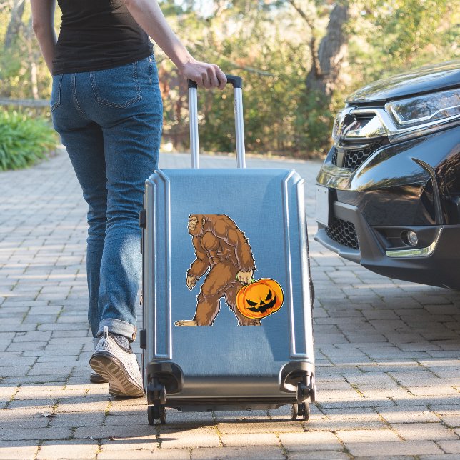Bigfoot Sasquatch Carrying Scary Pumpkin T shirt (Suitcase Insitu)