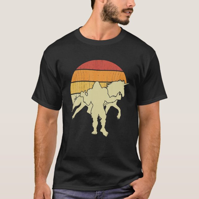 Bigfoot Walking Unicorn Horse Riding Funny Sasquat T-Shirt (Front)