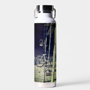 Bike against the scaffolding water bottle
