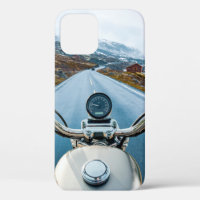 Biker rides a motorcycle on a slippery road throug
