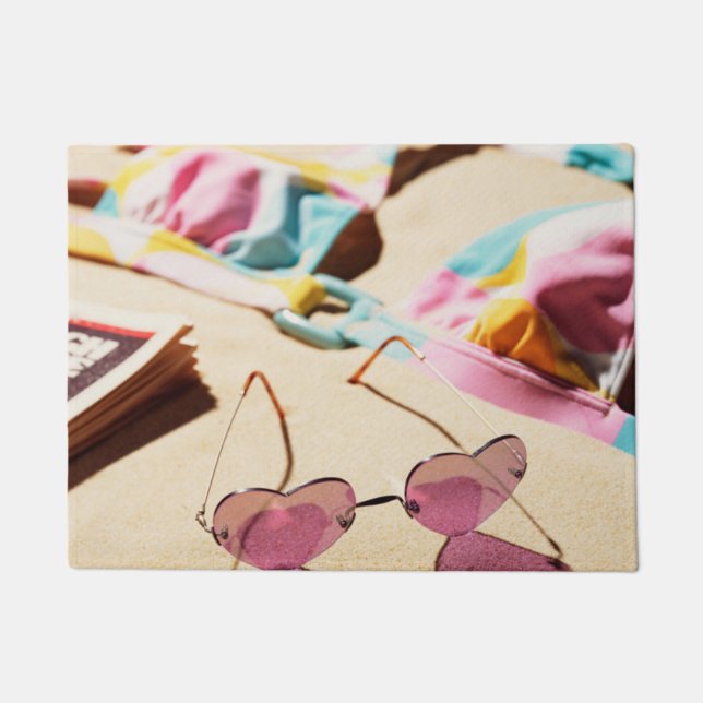Bikini Top And Heart Shape Sunglasses On Beach Doormat (Front)