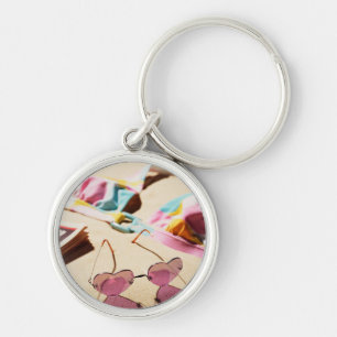 Bikini Top And Heart Shape Sunglasses On Beach Key Ring