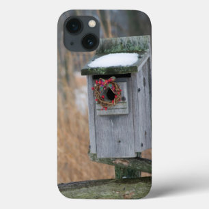 Bird, nest box with holiday wreath in winter iPhone 13 case