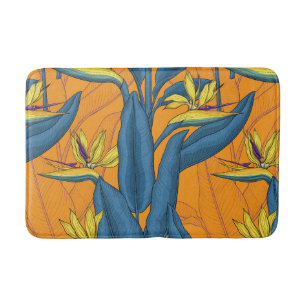 Bird of paradise flowers on orange bath mat