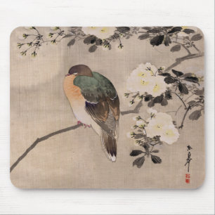 Bird perched on a branch of a blossoming tree mouse pad