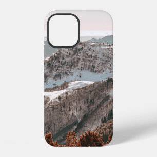 BIRD'S-EYE VIEW OF SNOW COVERED MOUNTAIN UNDER CLE iPhone 12 CASE