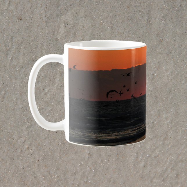 Birds Flying Over Ocean Photograph Coffee Mug (A mug with a photograph of sea gull birds flying over the ocean during sunrise.)