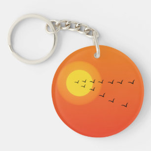 Birds flying to the sun key ring