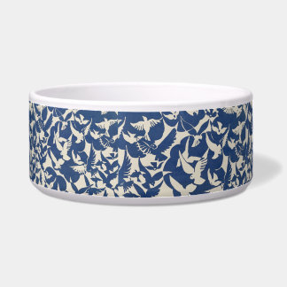 Birds in blue and white pet water bowl