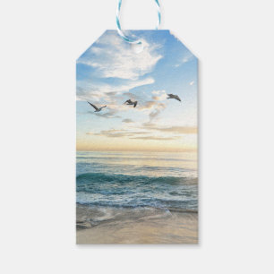 Birds in flight over the ocean gift tags